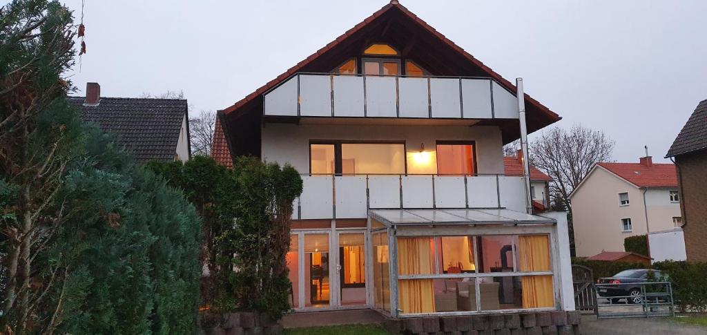 a house with a gambrel roof and windows at Ferienwohnung Wille in Lünen
