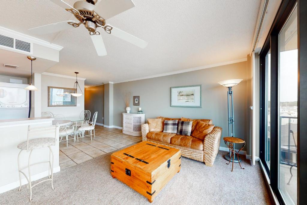 a living room with a couch and a table at Sea Colony - 502 Annapolis House in Bethany Beach