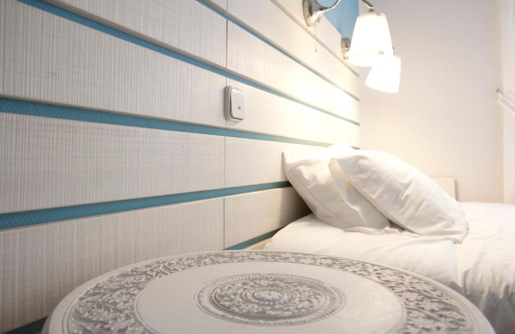 Posteľ alebo postele v izbe v ubytovaní Hostal Boreal Mistral