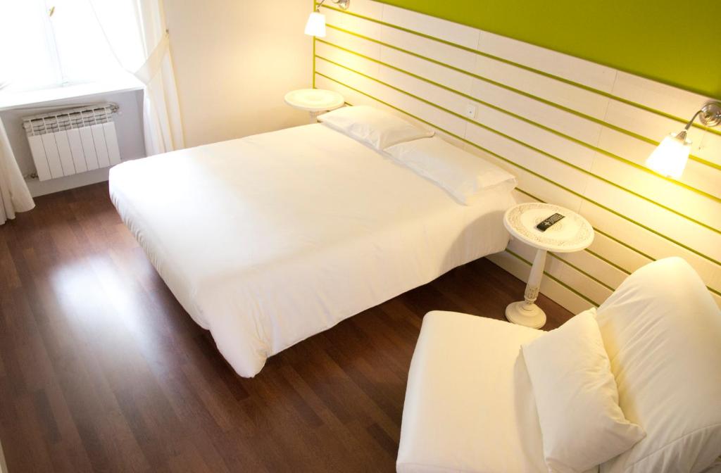 Posteľ alebo postele v izbe v ubytovaní Hostal Boreal Mistral