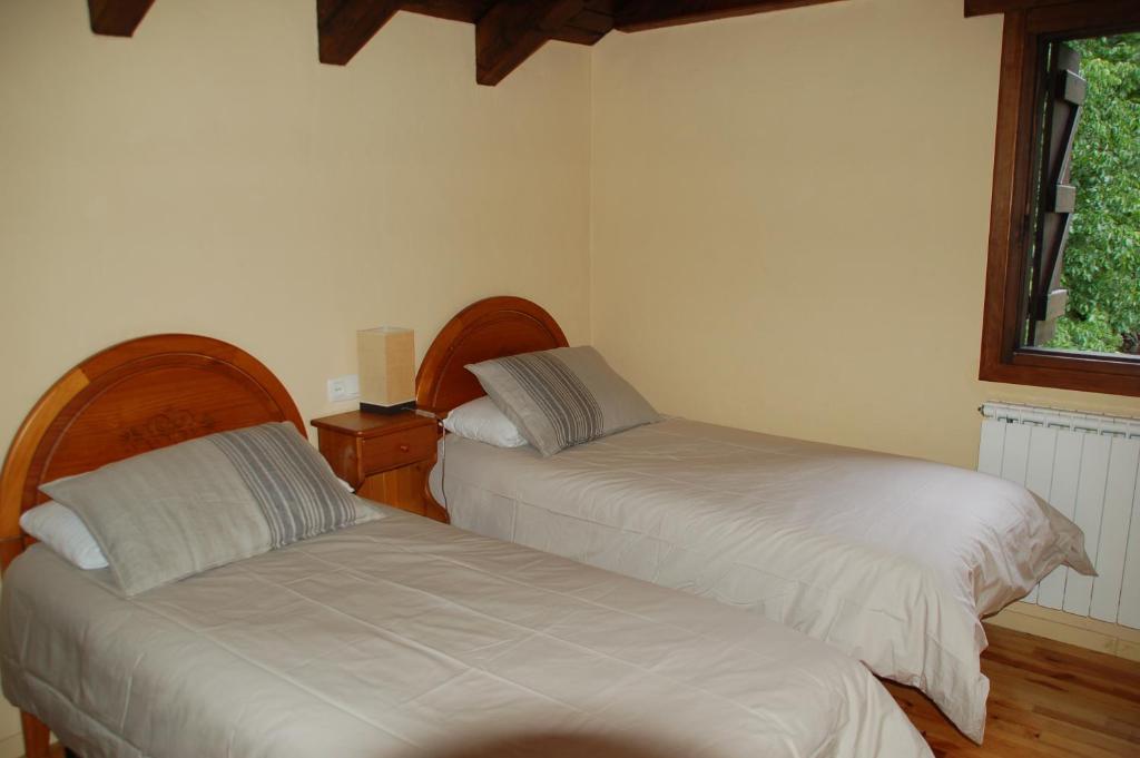 Postel nebo postele na pokoji v ubytování Hostal Casa Rosita