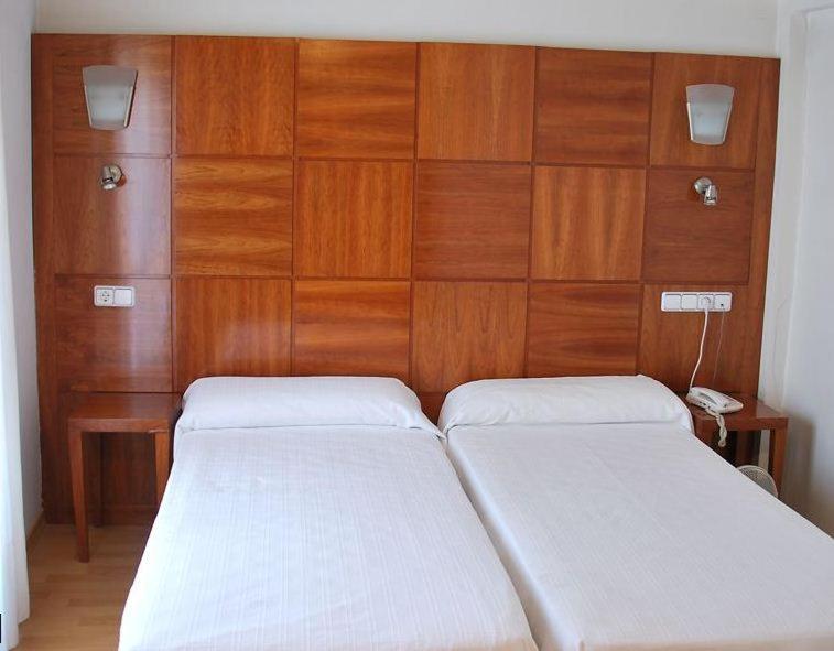 Postel nebo postele na pokoji v ubytování Hotel Trefacio