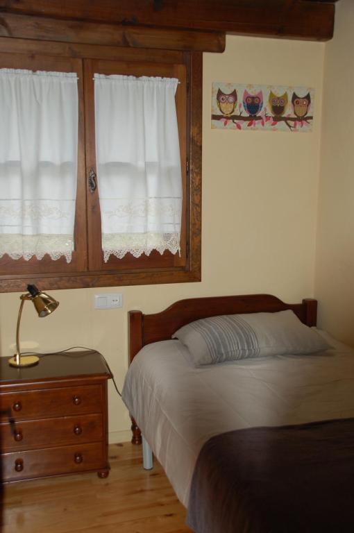 Postel nebo postele na pokoji v ubytování Hostal Casa Rosita