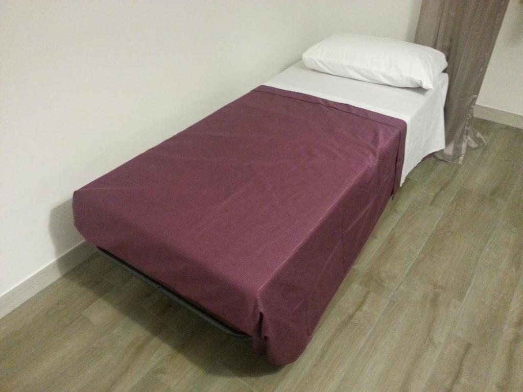 Łóżko lub łóżka w pokoju w obiekcie Appartamento B&B Suite Stefanelli