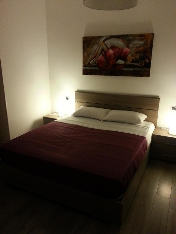 Łóżko lub łóżka w pokoju w obiekcie Appartamento B&B Suite Stefanelli