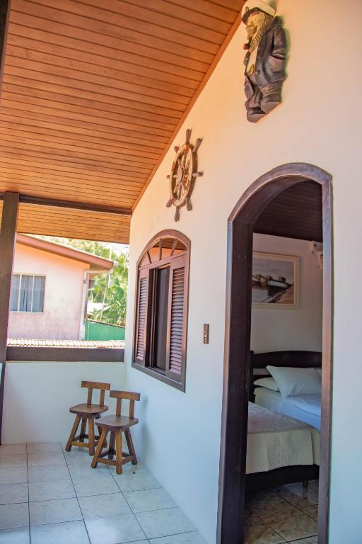 Cama ou camas em um quarto em Pousada Bob Pai & Bob Filho