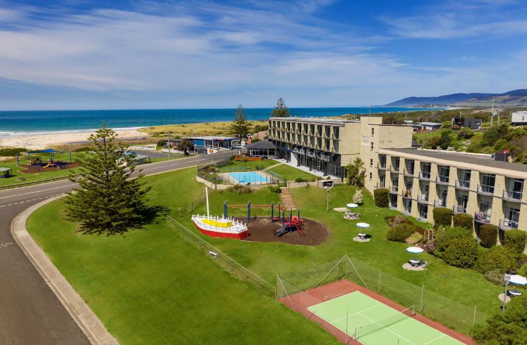 an aerial view of a hotel with a park at Scamander Beach Resort in Scamander