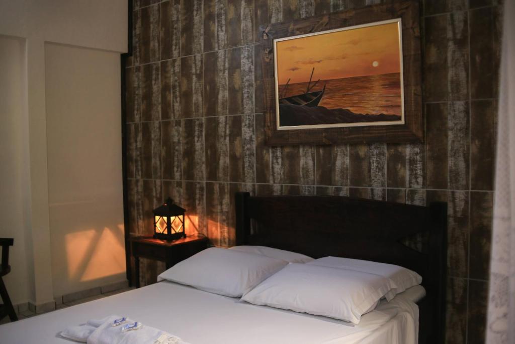 Cama ou camas em um quarto em Pousada Bob Pai & Bob Filho