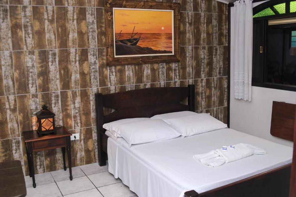 Cama ou camas em um quarto em Pousada Bob Pai & Bob Filho