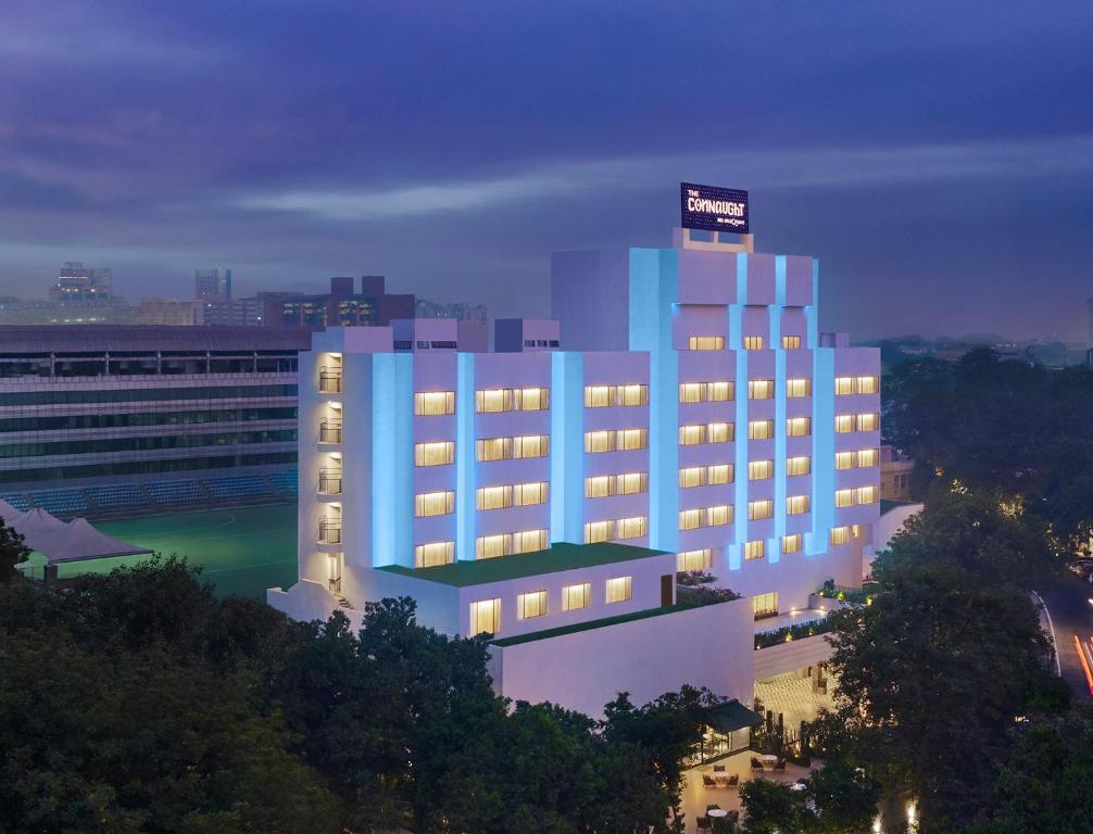 a lit up building with a sign on top of it at The Connaught, New Delhi- IHCL SeleQtions in New Delhi