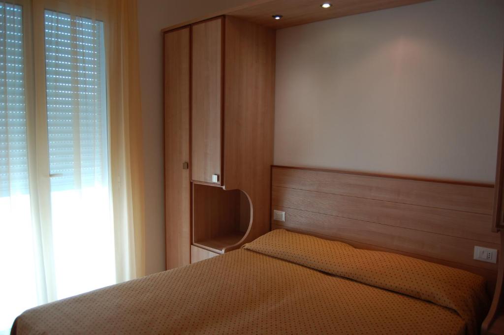 Postel nebo postele na pokoji v ubytování Hotel Massimo