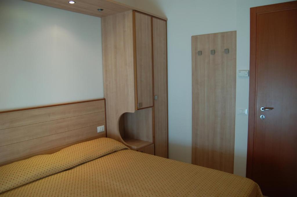 Postel nebo postele na pokoji v ubytování Hotel Massimo