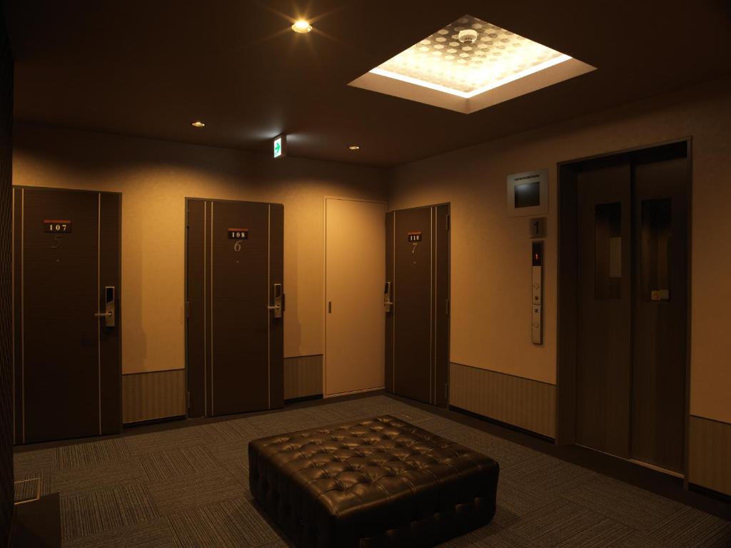 Postel nebo postele na pokoji v ubytování SlowTime Hotel Kyoto
