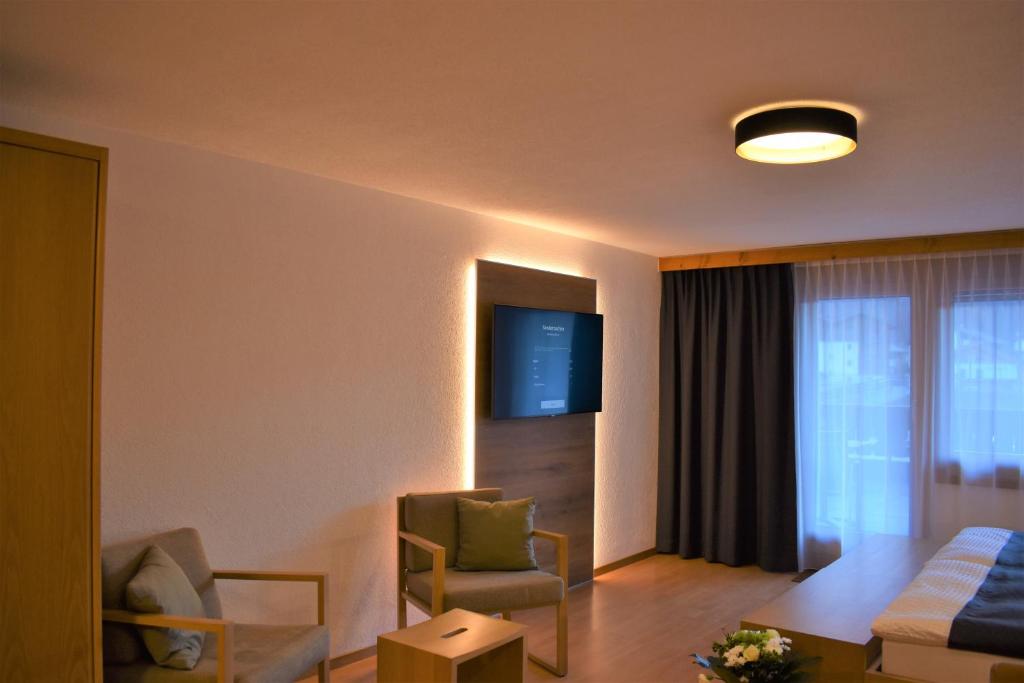 TV a/nebo společenská místnost v ubytování Appartementhaus Crystal