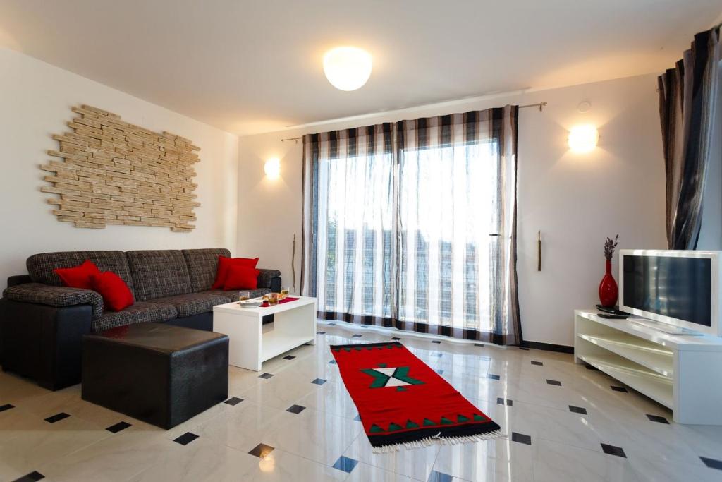 TV a/nebo společenská místnost v ubytování Apartments Adria