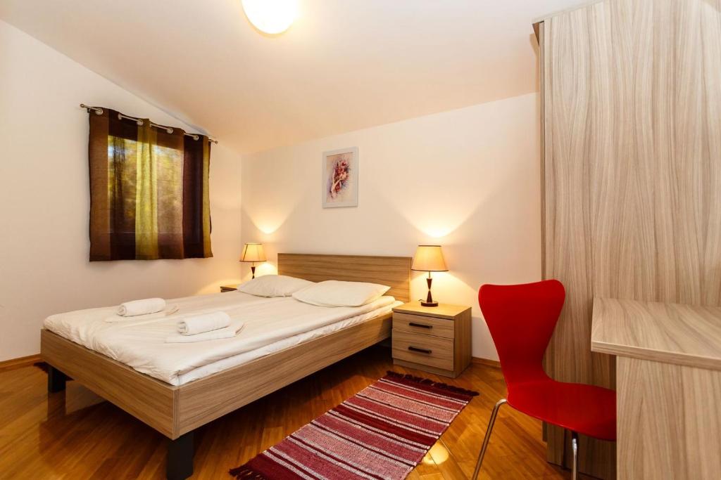 Postel nebo postele na pokoji v ubytování Apartments Adria