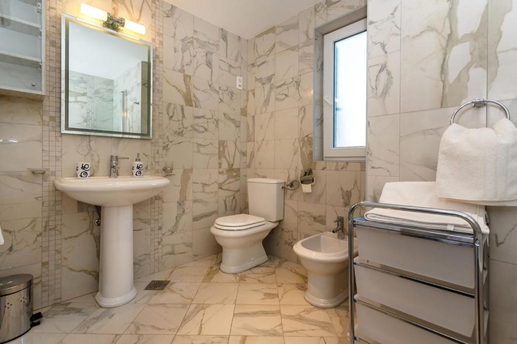 Koupelna v ubytování Apartments Adria