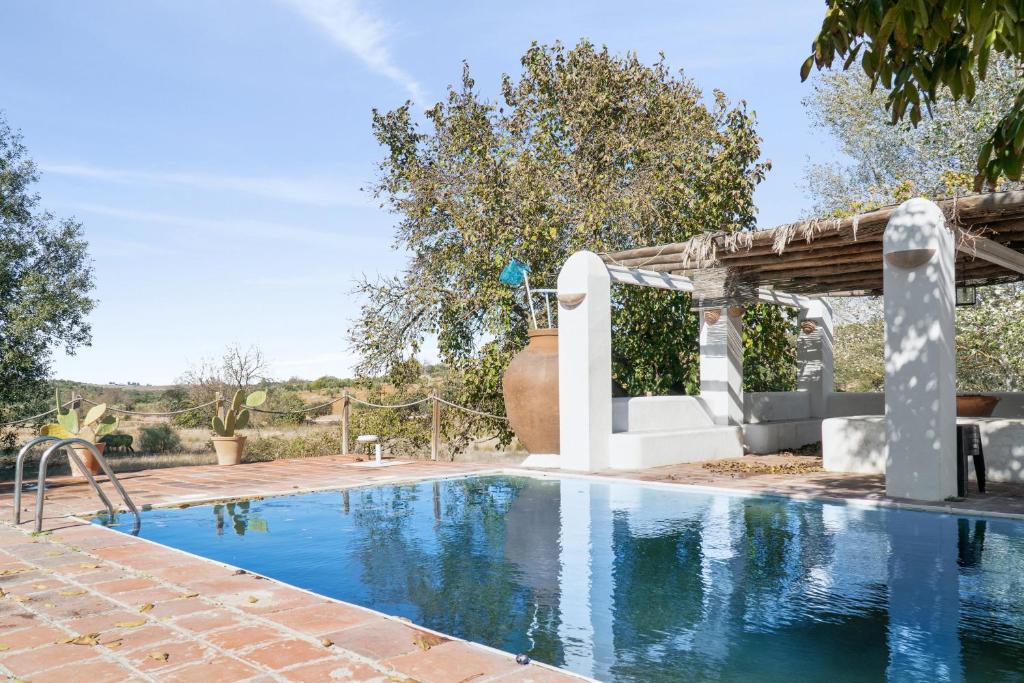 a swimming pool in the backyard of a house at 4 bedrooms villa with private pool enclosed garden and wifi at Valverde de Leganes in Valverde de Leganés