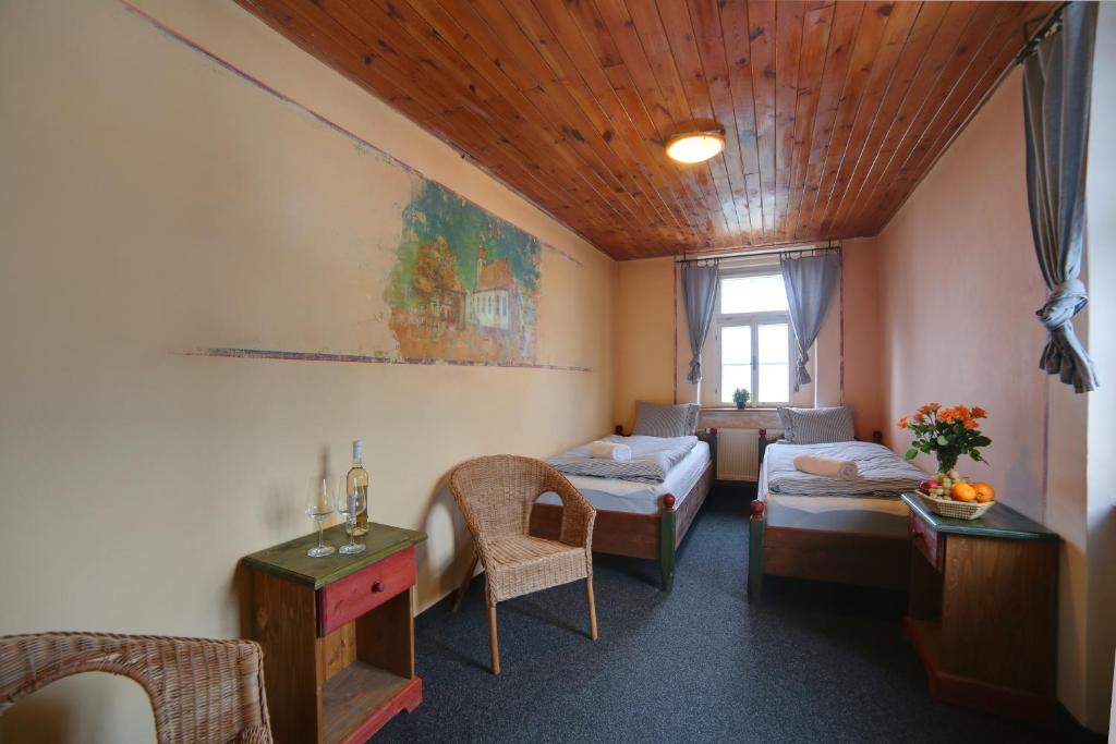 Postel nebo postele na pokoji v ubytování Hotel Plesivec