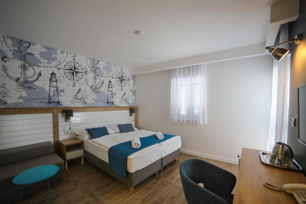 Postel nebo postele na pokoji v ubytování HOTEL IVANDO - K&S