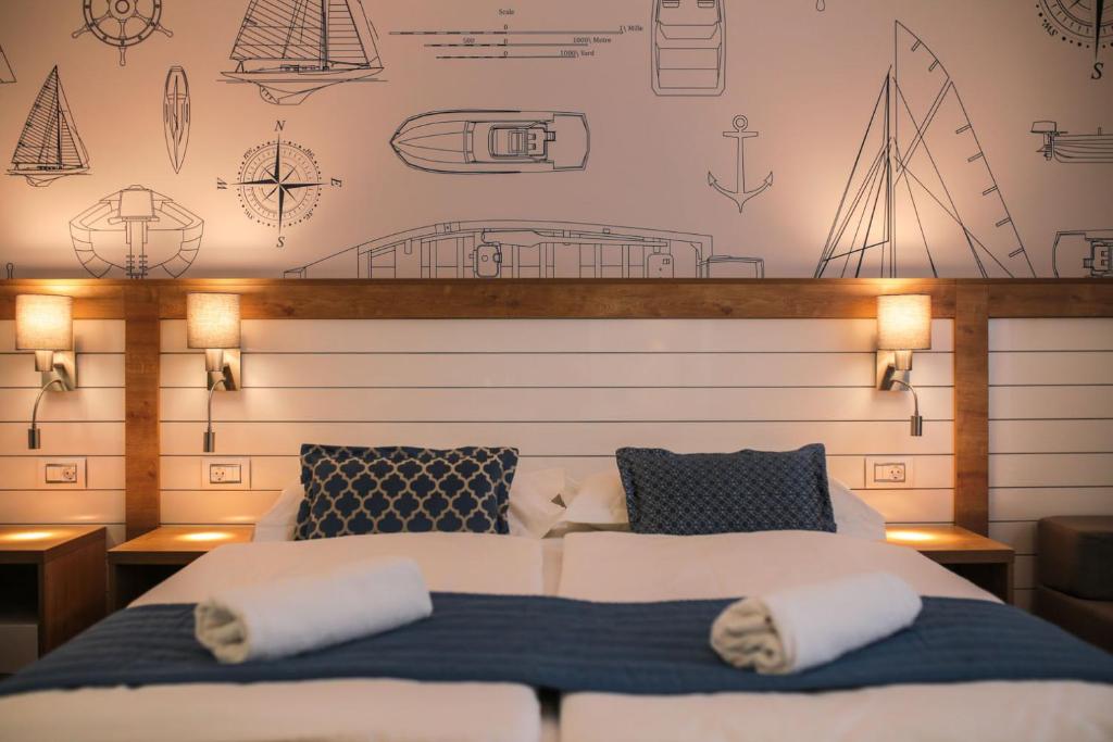 Postel nebo postele na pokoji v ubytování HOTEL IVANDO - K&S