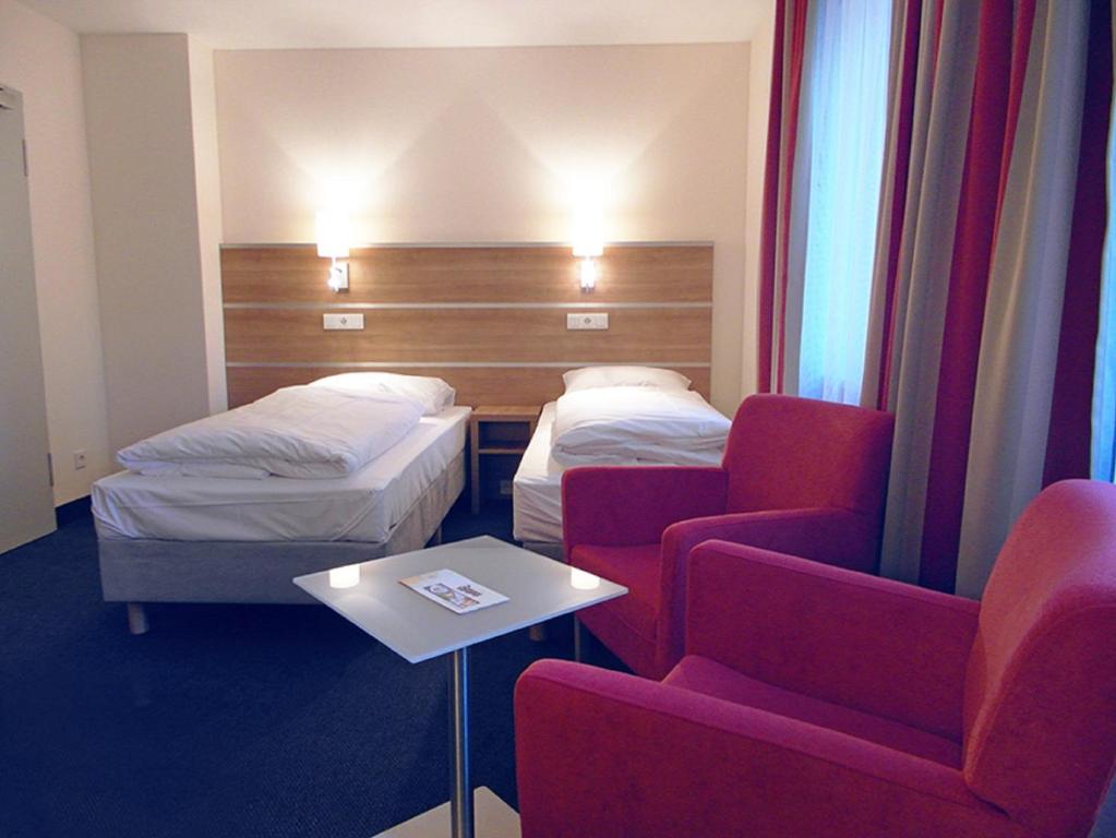 Postel nebo postele na pokoji v ubytování Hotel-Gasthof Rangau