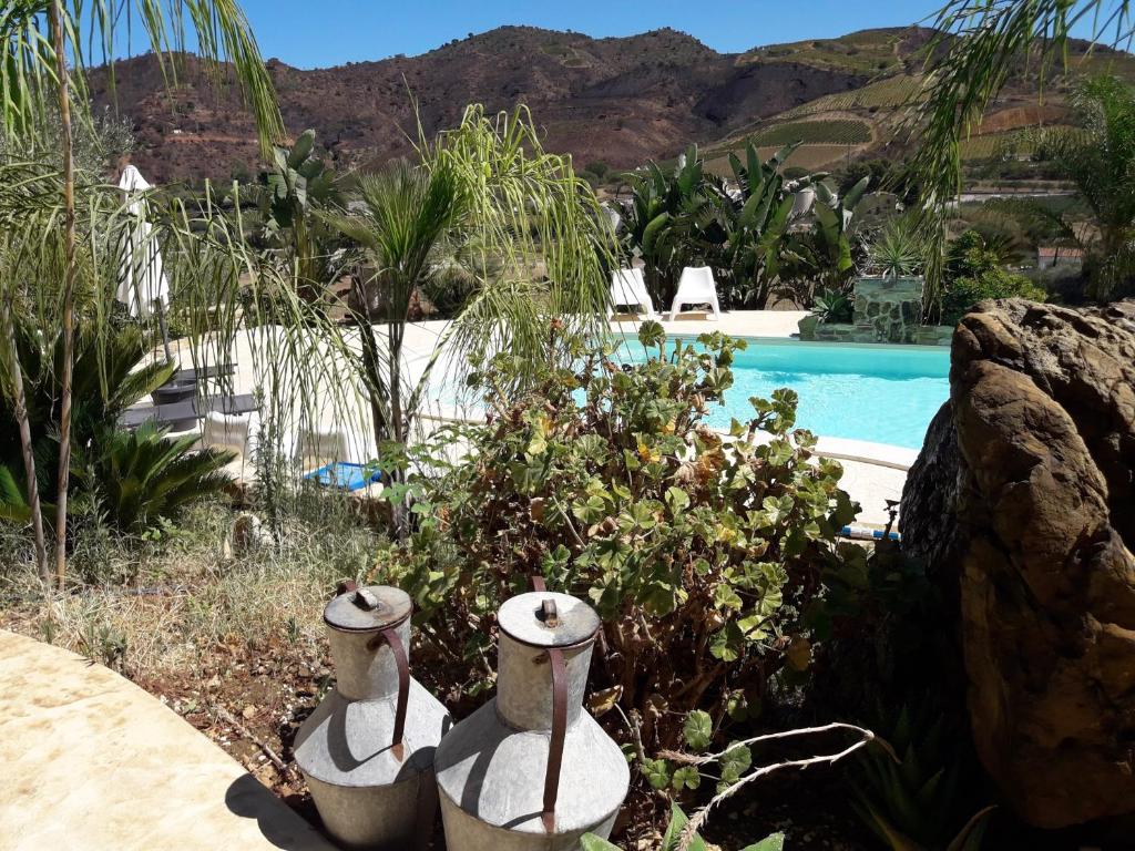 The swimming pool at or close to La Suite Di Segesta