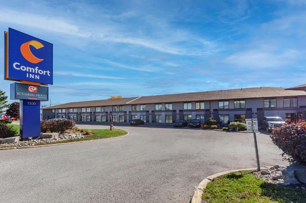 a hotel sign in front of a building at Comfort Inn Airport West in Mississauga