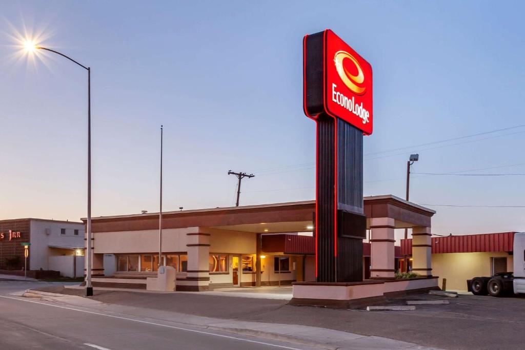 a mobil gas station with a sign in front of it at Econo Lodge Clovis in Clovis