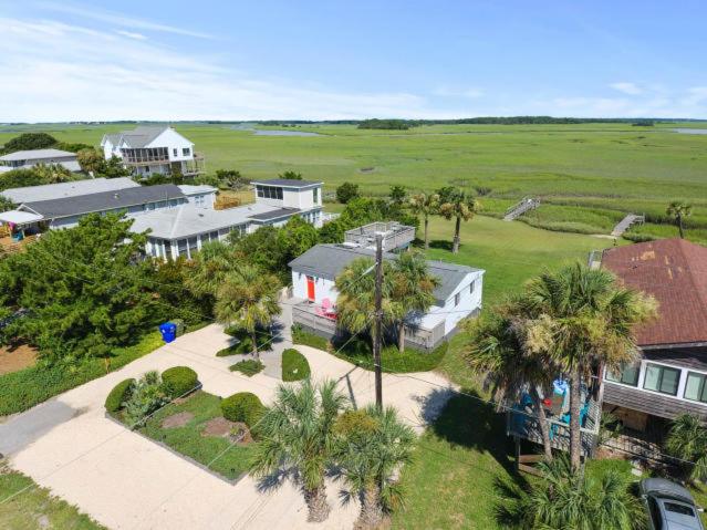 an aerial view of a house with palm trees at 1684 E Ashley - Sol Searcher - 2 Bedrooms in Folly Beach
