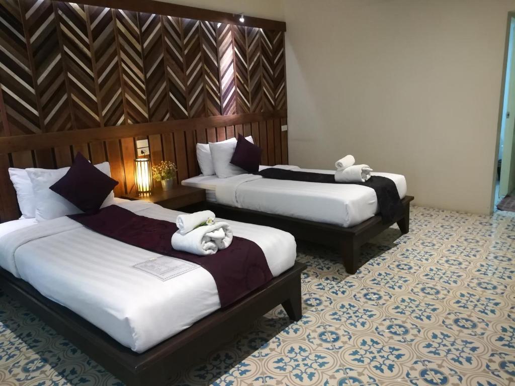 Postel nebo postele na pokoji v ubytování Good Times Resort Kanchanaburi