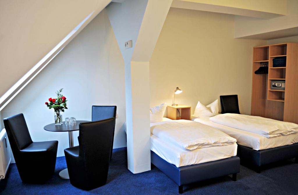 Postel nebo postele na pokoji v ubytování Hotel Transit Loft