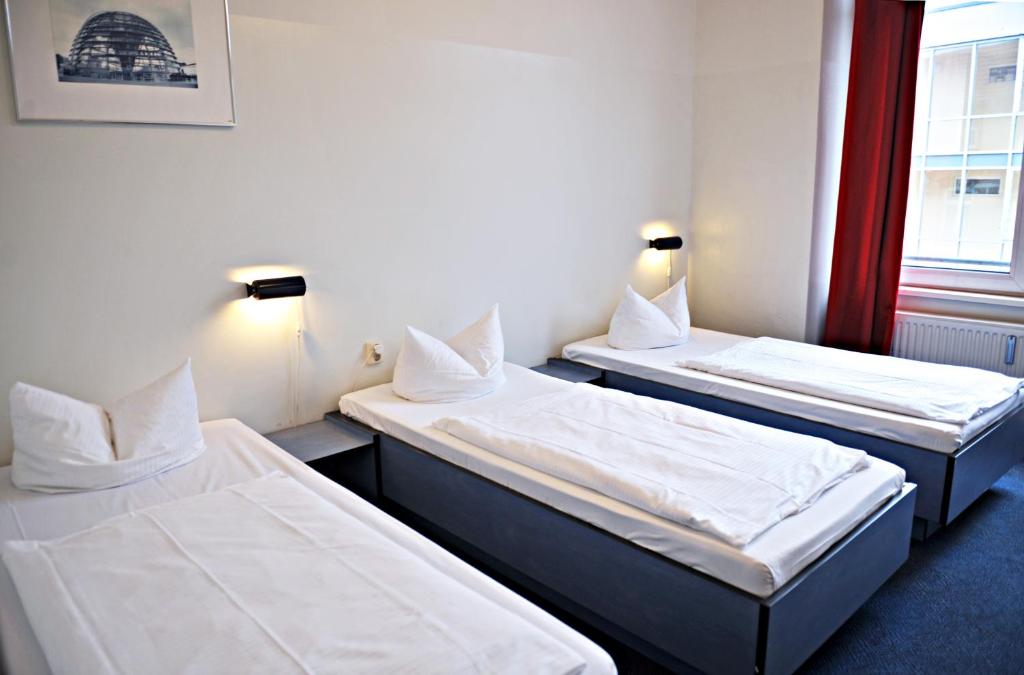 Postel nebo postele na pokoji v ubytování Hotel Transit Loft