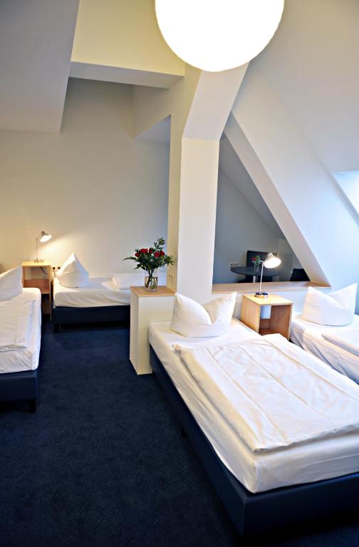 Postel nebo postele na pokoji v ubytování Hotel Transit Loft