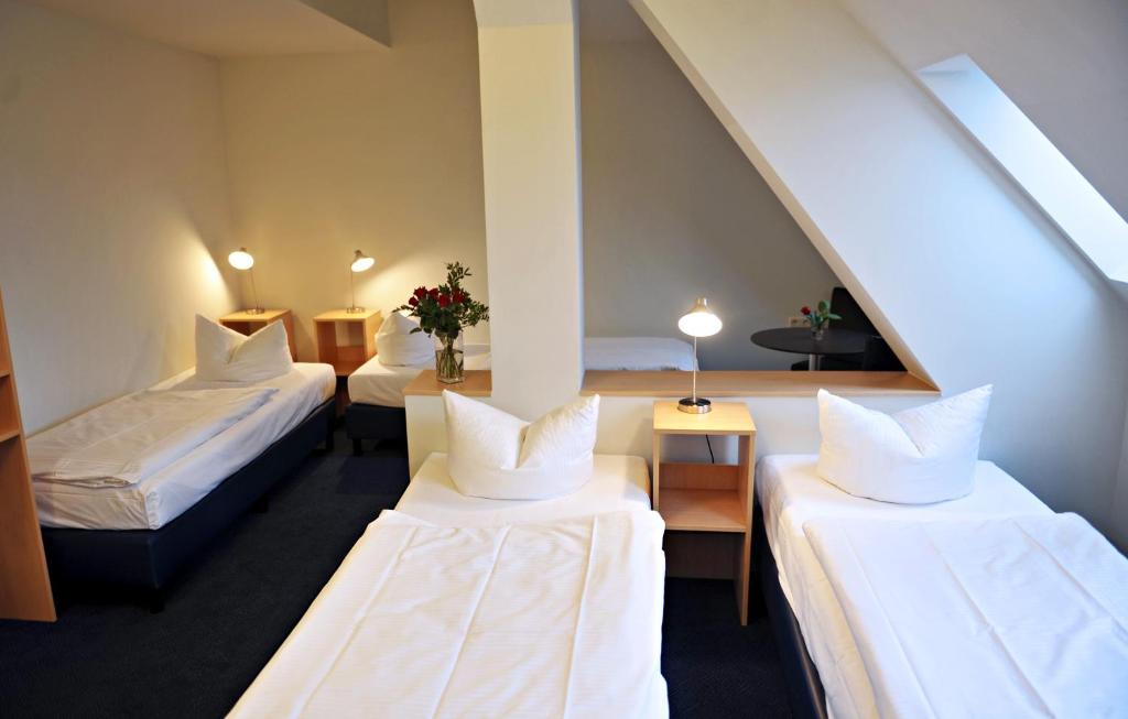 Postel nebo postele na pokoji v ubytování Hotel Transit Loft
