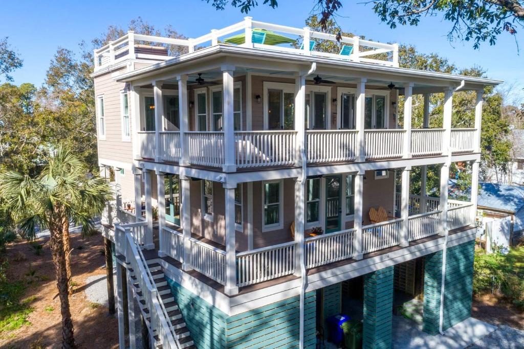 an image of a house with a wrap around porch at 316 E Hudson - The High Tides - Hot Tub - 4 Bedrooms in Folly Beach