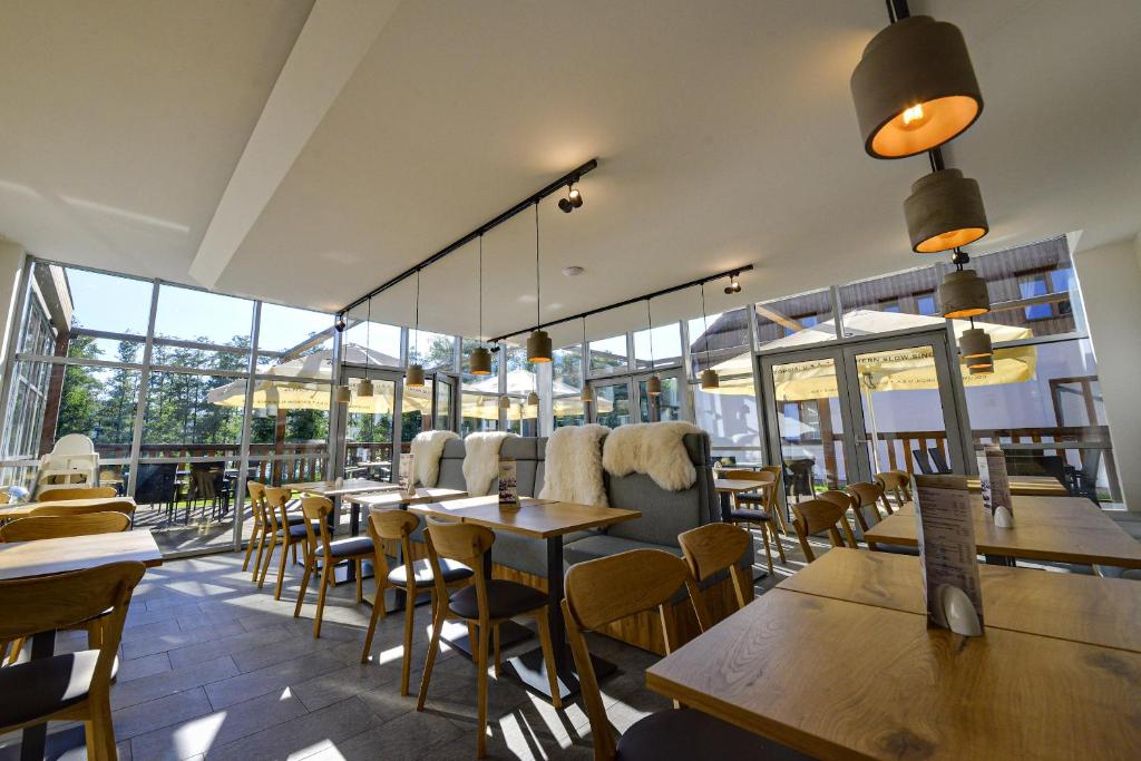 Ein Restaurant oder anderes Speiselokal in der Unterkunft Resort Orsino 