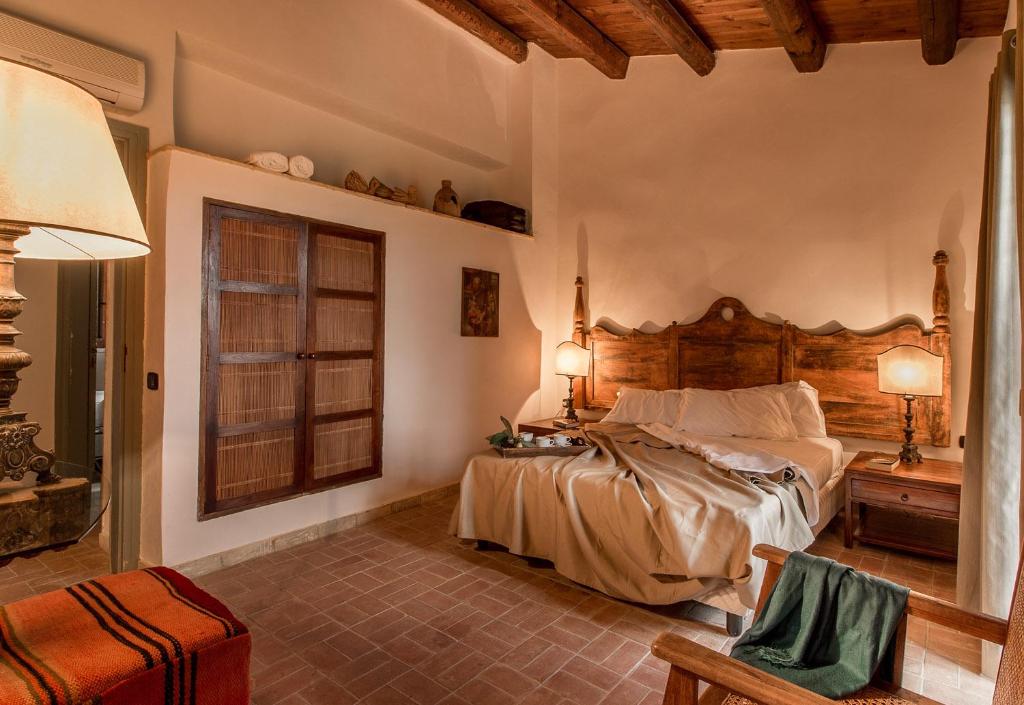 Łóżko lub łóżka w pokoju w obiekcie Luxury Sicily Villas by Geocharme