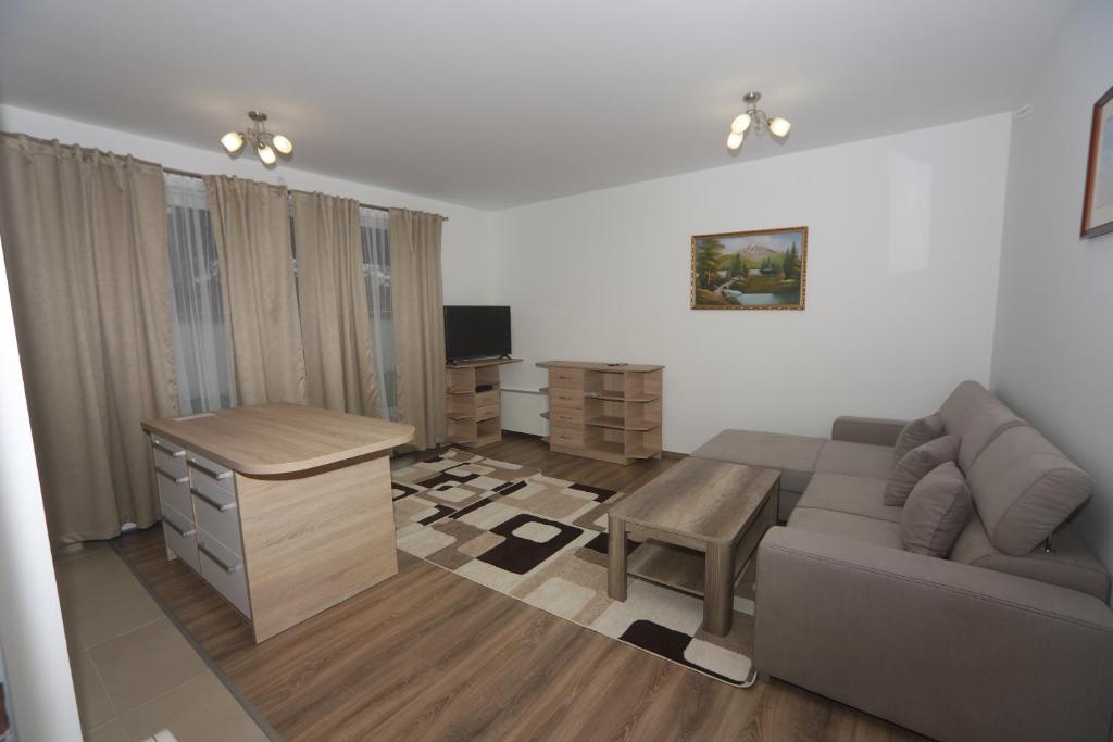 Televízia a/alebo spoločenská miestnosť v ubytovaní Ádám Guesthouse I.