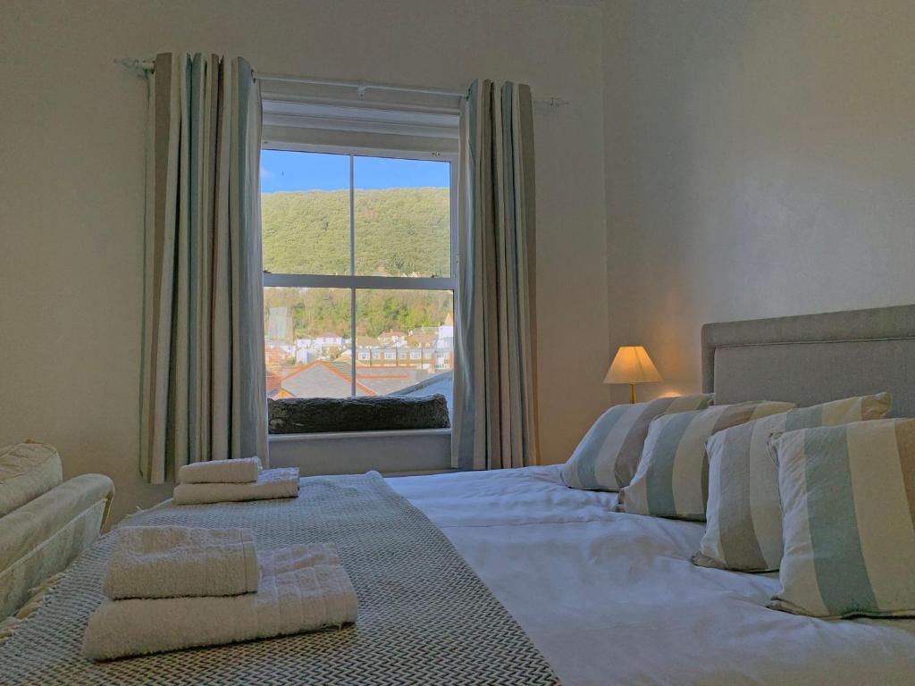 Postel nebo postele na pokoji v ubytování Ventnor Bay House
