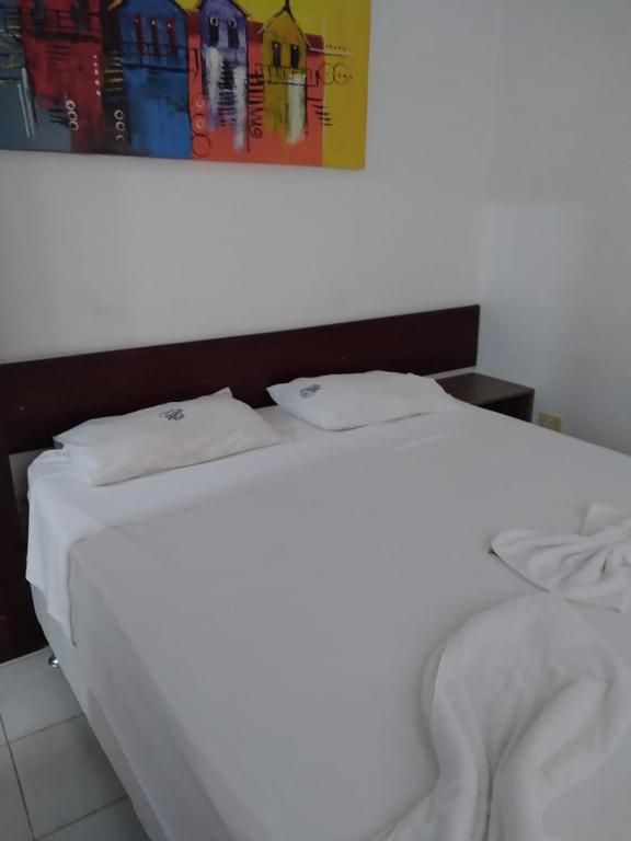 Pousada Sky Beach Flatにあるベッド