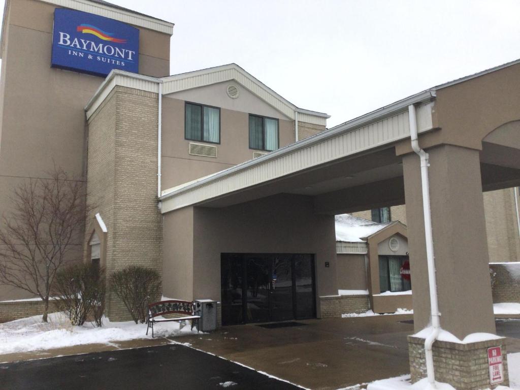 a building with a sign on the front of it at Baymont by Wyndham Flat Rock in Flat Rock