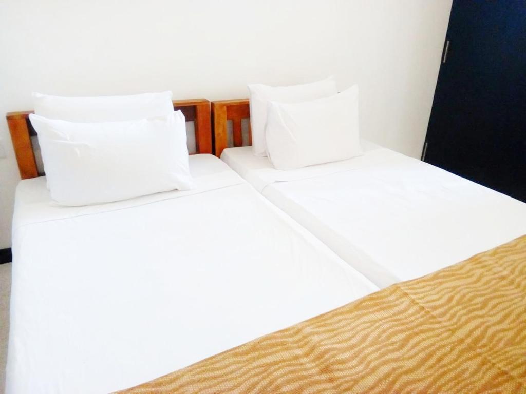 Letto o letti in una camera di The Nest
