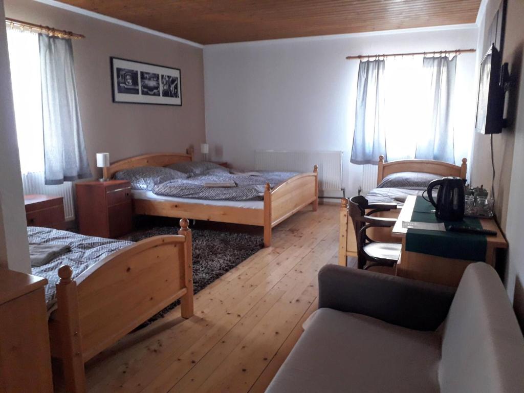Postel nebo postele na pokoji v ubytování Penzion Na Střelnici