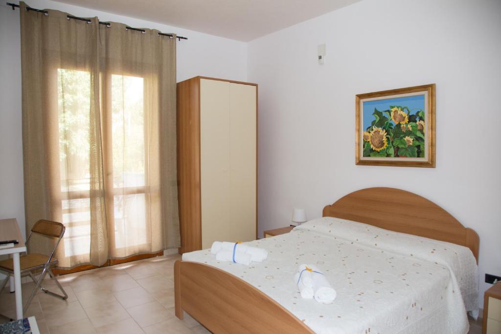 Postel nebo postele na pokoji v ubytování VILLA VEGA