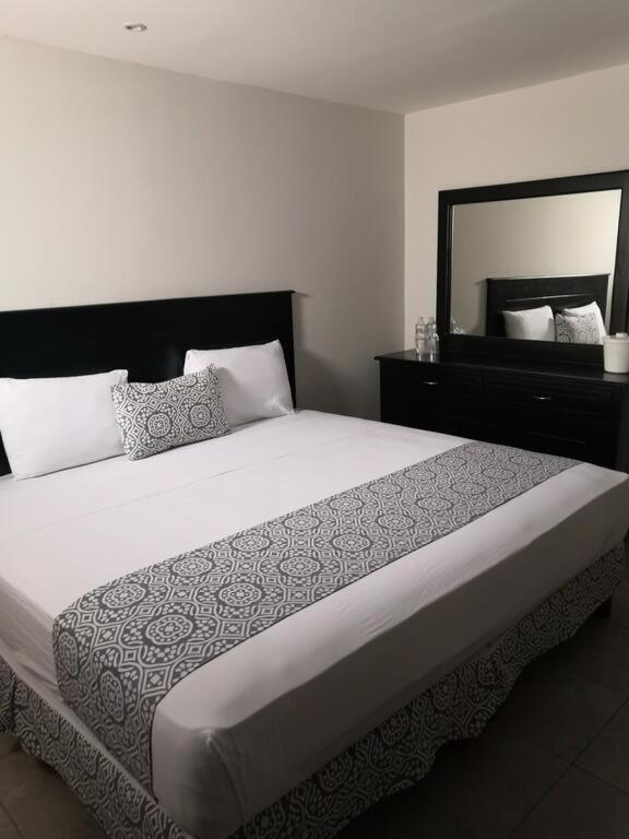Postel nebo postele na pokoji v ubytování Hotel Costa Verde