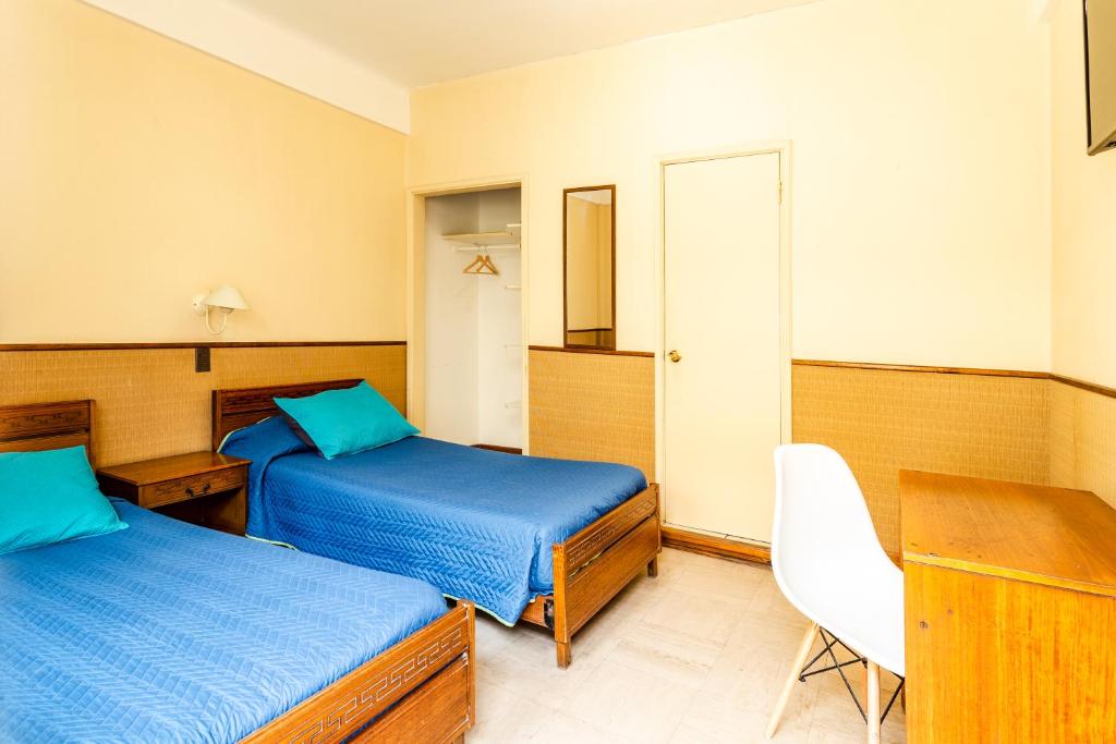 Postel nebo postele na pokoji v ubytování Hostel Del Puerto