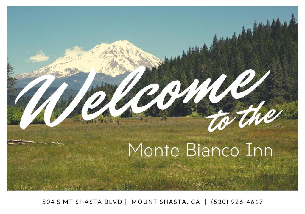 a welcome to the moraine blanca sign with a mountain at Monte Bianco Inn in Mount Shasta