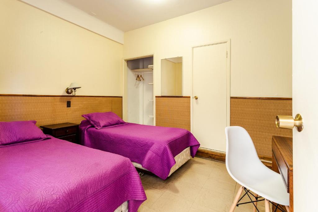 Postel nebo postele na pokoji v ubytování Hostel Del Puerto