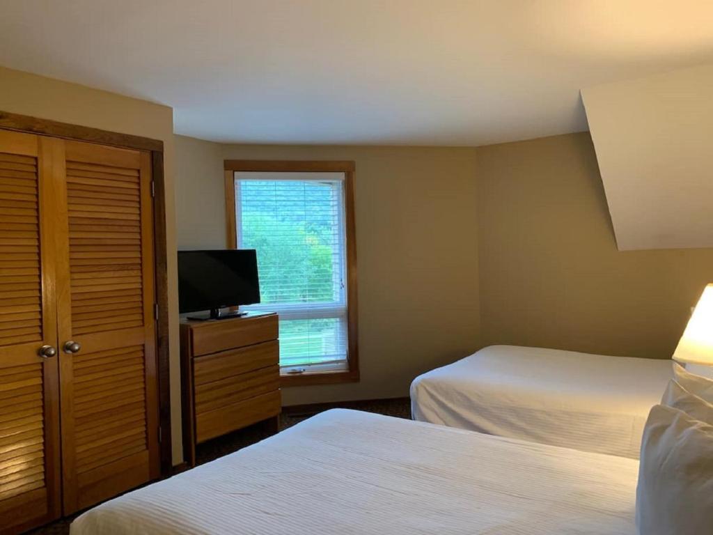 Postel nebo postele na pokoji v ubytování Pocono Villas Resort